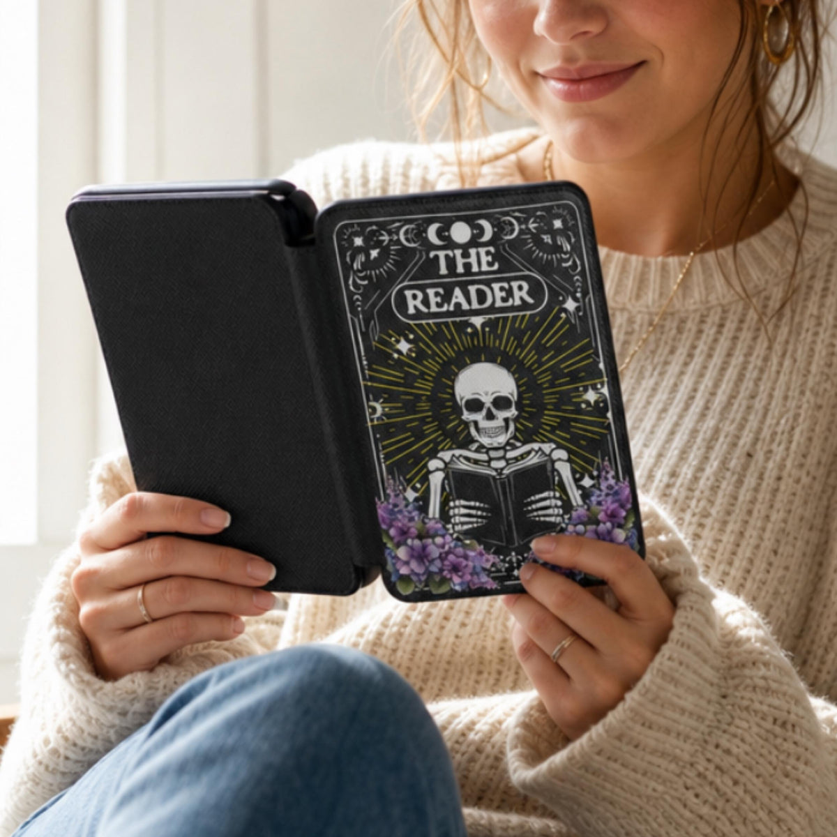 E-Reader Protective Case Kindle Paperwhite Cover Magnetic Closure Hand Strap Skeleton Reading Design Device Protection Soft Interior Lining Celestial Moon Star Imagery Purple Floral Details Book Lover Accessory Literary Gift Perfect Reader